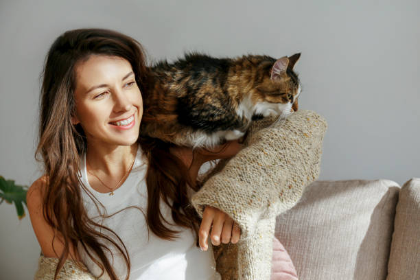 istock Young woman and her cat 1358961460