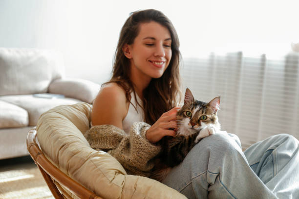 istock Young woman and her cat 1358961499