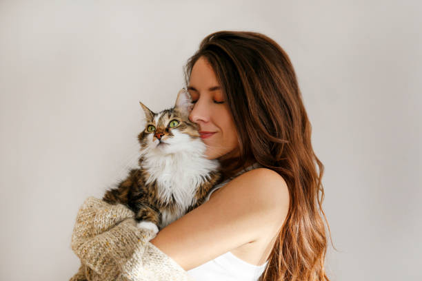istock Young woman and her cat 1358961504