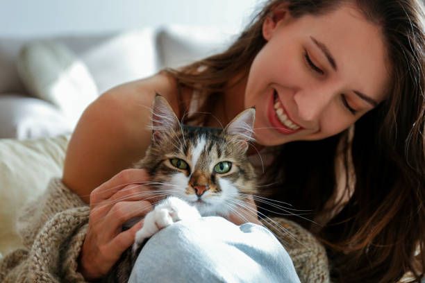 istock Young woman and her cat 1358961506