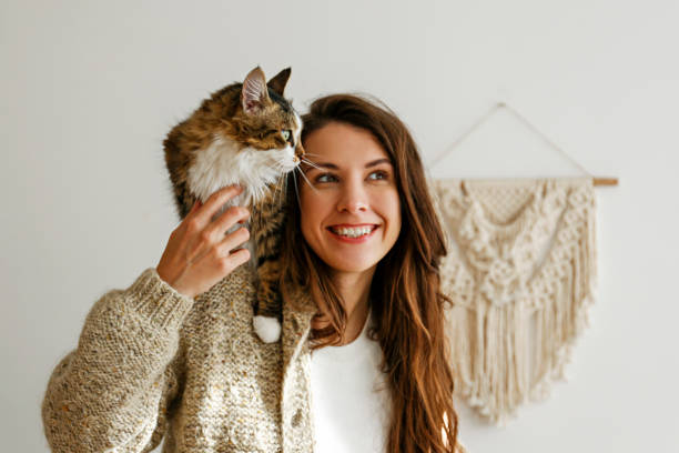 istock Young woman and her cat 1358961516