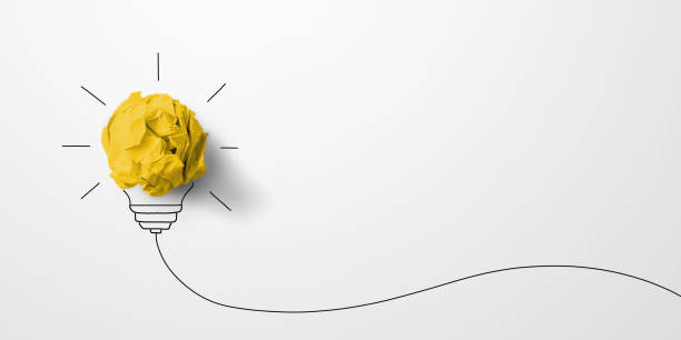 istock Creative thinking ideas and innovation concept. Paper scrap ball yellow colour with light bulb symbol on white background 1358962235