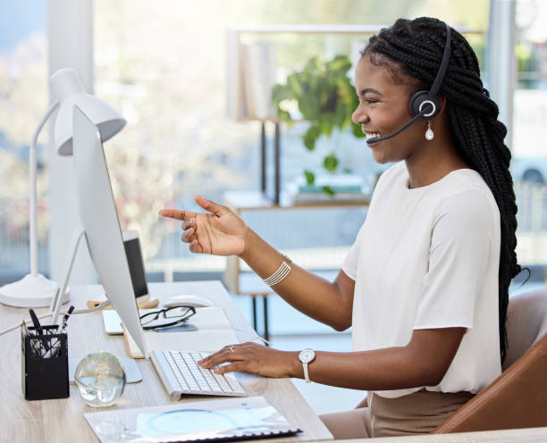 istock Shot of a young female call center agent using a computer at work 1358963584