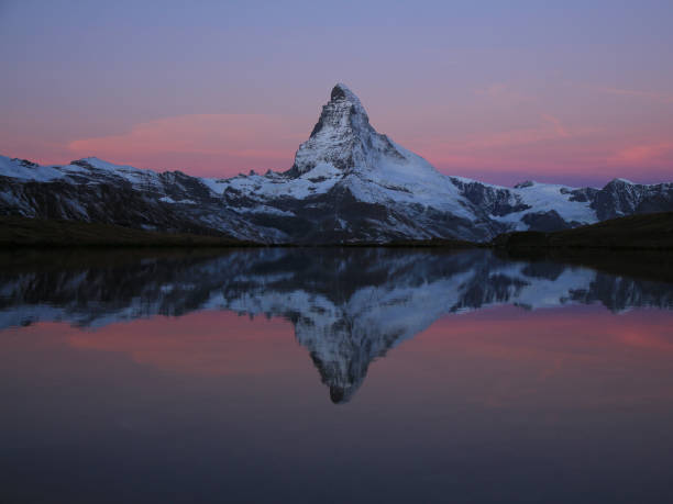 istock Pink sky and Matterhorn at sunrise. 1358963861