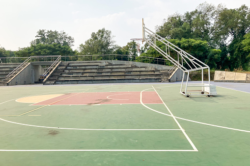 Basketball court at school where no one plays.