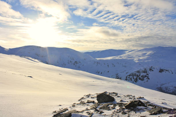 istock Snow-capped mountains in winter on a sunny day. 1358967596