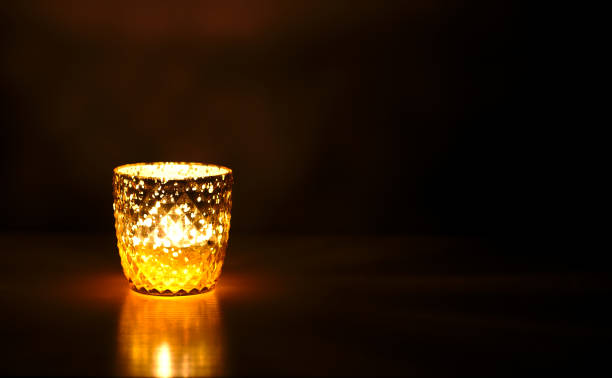 istock Burning candle in the dark. 1358967696