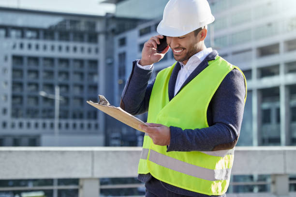 istock Shot of a young businessman using his smartphone on a construction site 1358968990