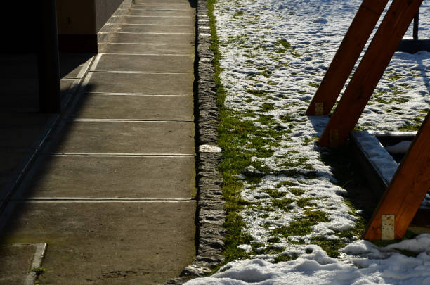 A abstract image of a set of outdoor stairs covered in snow.