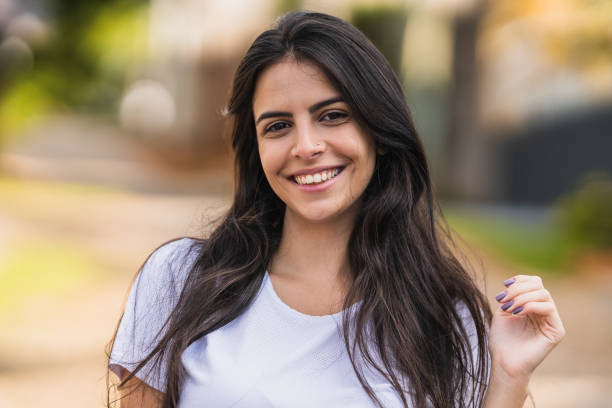 istock Front view of a smiling woman 1358970994
