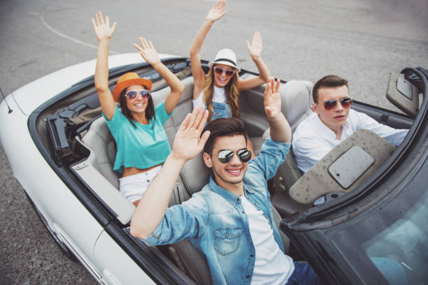 istock Friends in cabriolet 1358971602