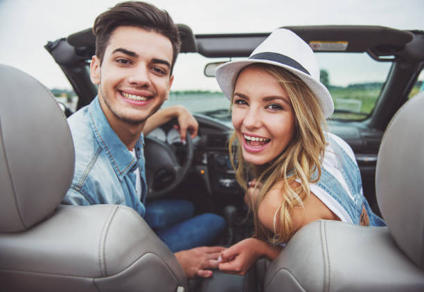 istock Friends in cabriolet 1358972337