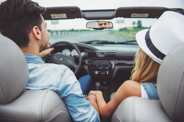 istock Friends in cabriolet 1358972379