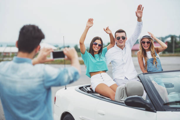 istock Friends in cabriolet 1358973116