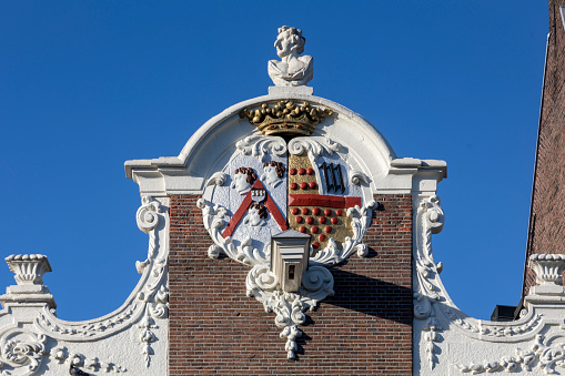 beautifully decorated facade of a house along one of the canals in Amsterdam
