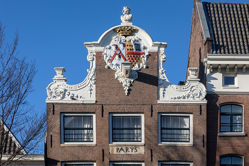 beautifully decorated facade of a house along one of the canals in Amsterdam