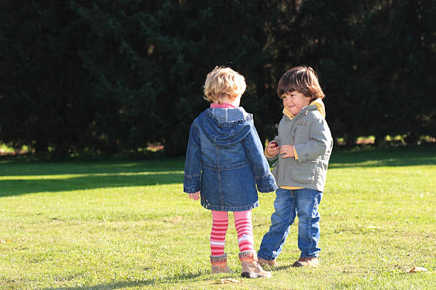 istock Boy and girl in the park 135897553