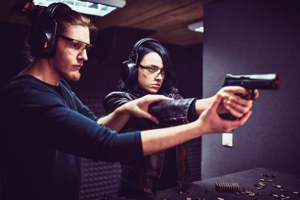 istock Shooting Lessons For Focused Female By Male Instructor 1358976004