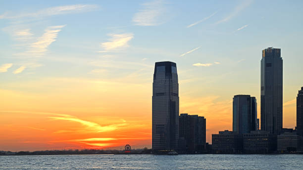istock Jersey City skyline. Sunset at lower Hudson River 1358976161