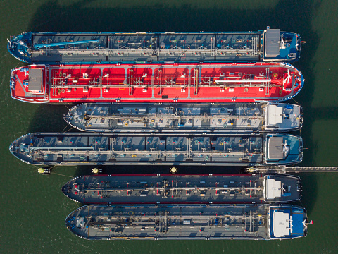aerial view of a group of barges transporting oil and gas on the major rivers