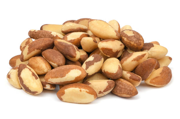Pile of Brazil nut isolated on white background. Organic nuts stock photo