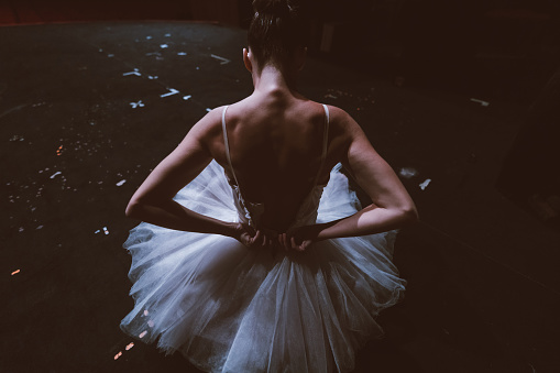 Standing ballerina in a white tutu