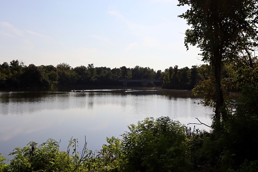 A view of the peaceful lake on a clear sunny morning.