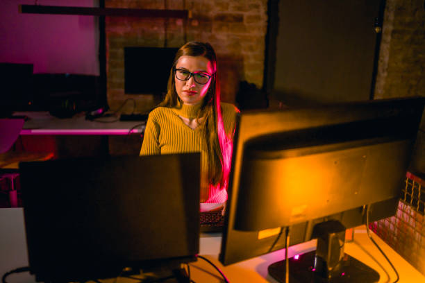 istock Concentrated woman working late 1358981200