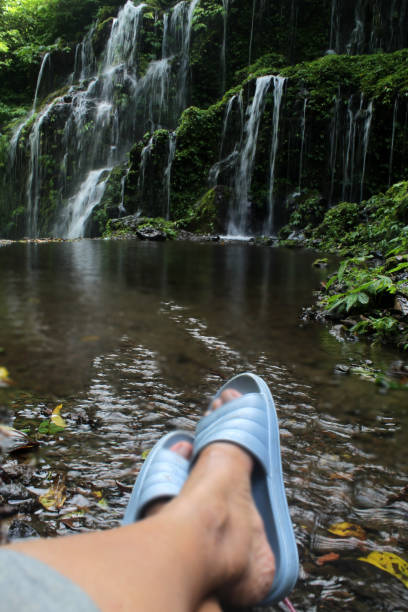 istock Relax feet in the waterfall. 1358982358