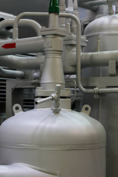 Modern industrial refrigeration equipment. Steel tanks and pipes. Selective focus.