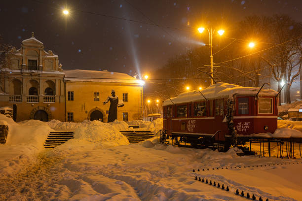 Empty Railway Station Platform Covered In Snow At Night With Glowing Lights And A Bench, Calm Blue Hour Transportation Scene For Waiting, Commuting, Winter Travel, And Public Transit.