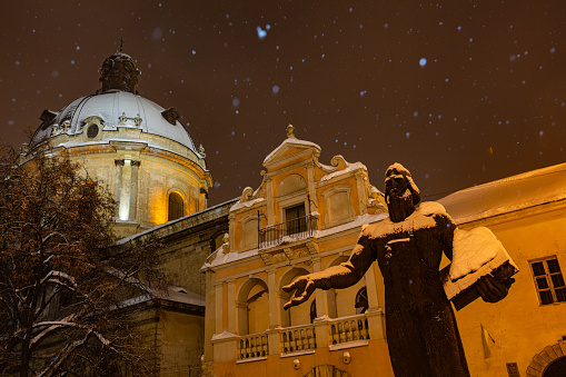 Lviv, Ukraine - February 17, 2021:monument to Ivan  Fedorov in Lviv  in winter