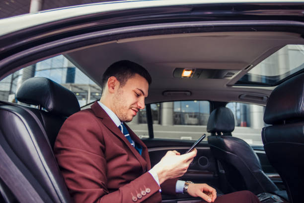 istock Businessman looking in his mobile 1358987467