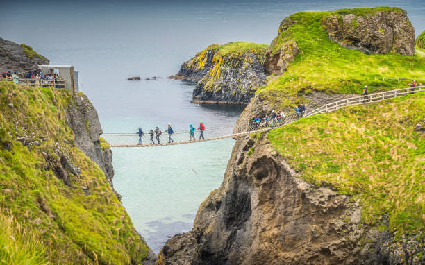 Closeup on people on the Carrick a Rede rope bridge, Northern Ir stock photo