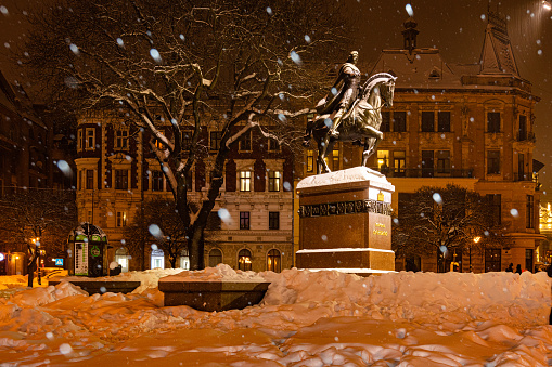 Lviv, Ukraine - February 17, 2021: Monument to Danylo Halytskyi in Lviv in winter at night