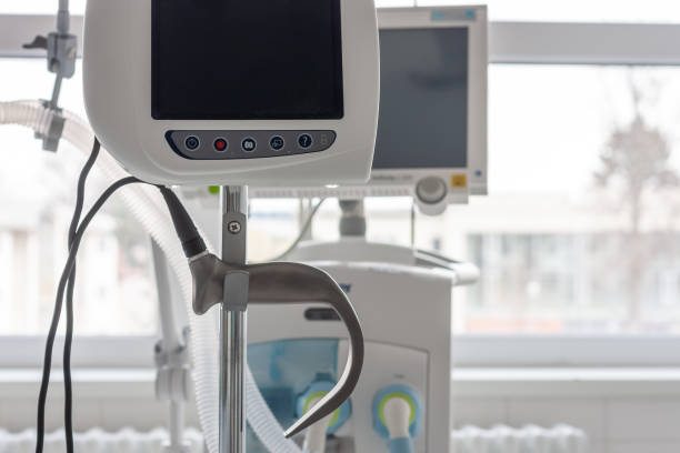 Video laryngoscope , on background medical ventilator in ICU in hospital. stock photo