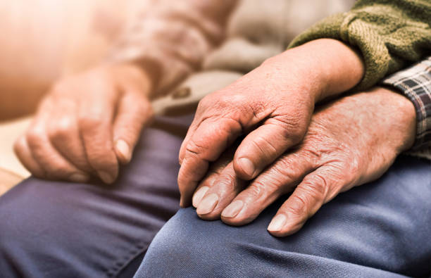 istock the hands of an elderly couple 1358991631