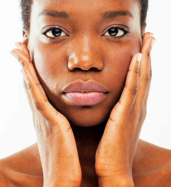 young pretty african american woman naked taking care of her ski stock photo