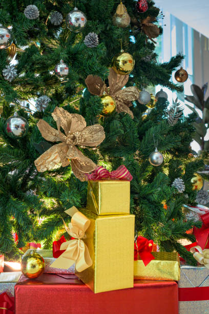 istock Gift boxes and Christmas trees decorated with colorful ornaments. 1358992038