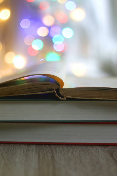 istock Stack of Books and Colorful Lights 1358993902