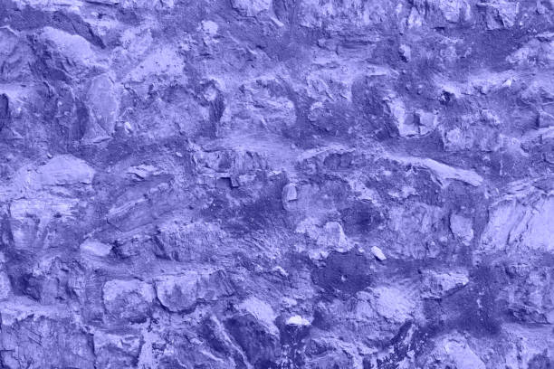 Purple Very Peri Stones texture and background. Rock texture stock photo