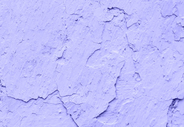 Old concrete Purple Very Peri walls with cracks  background paint, workpiece for design, copy spase. stock photo