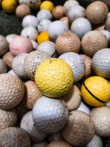 istock Golf balls piled up on the floor 1358994732