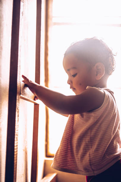 istock one year kid playing at home 1358994751