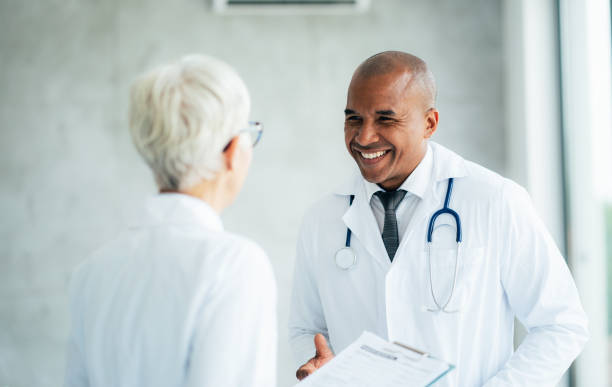 istock Two doctors talking at hospital 1358994925