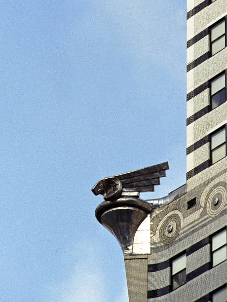 Art Deco gargoyle design Chrysler building, New York City, New York State, United States of America Art Deco gargoyle design Chrysler building, Turtle Bay, New York City, New York State, This grainy film image represents the art deco age style. United States of America, USA. The cities of America contain significant famous landmarks that define the country and are internationally recognised as icons of the continent. chrysler building eagles stock pictures, royalty-free photos & images
