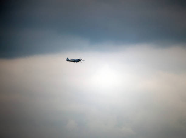 Vickers Supermarine Spitfire PR version single seat fighter, Bournemouth, Dorset, England, UK. A single solo aircraft flying in moody sky at a free-to-view location over the sea off Bournemouth beach, Dorset, England, UK