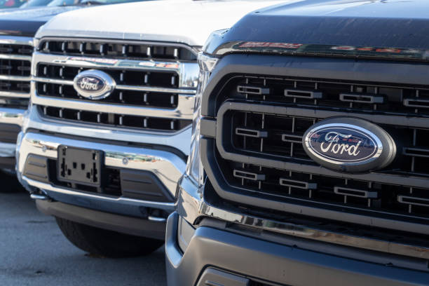 Ford F-Series Trucks Display. The Ford F-150, Super Duty F-250, F-350 and F-450 are the best selling trucks in the US. stock photo