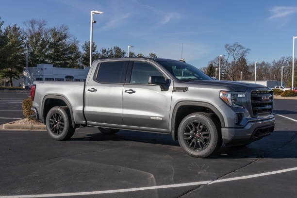 gmc sierra 1500 elevation pickup truck display. gmc is a division of gm and offers the sierra 1500 in limited and slt models. - truck military armed forces pick up truck imagens e fotografias de stock