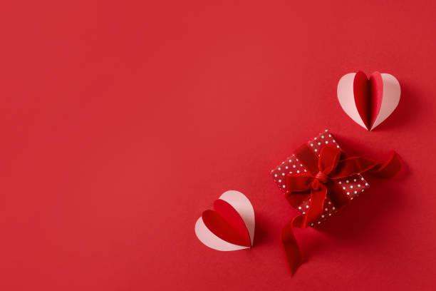 istock Red background flat lay with gift, paper hearts, gift box, valentines day, mothers day concept 1359007191